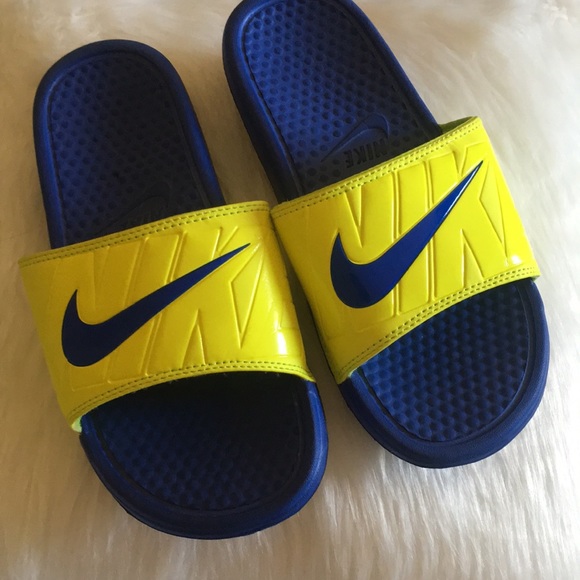 blue and yellow nike slides